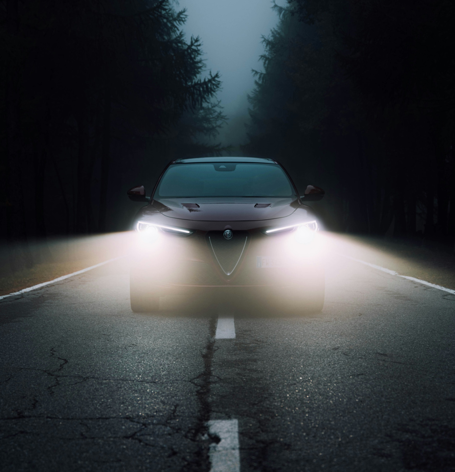 Car driving at night on open road, symbolizing self-directed journey